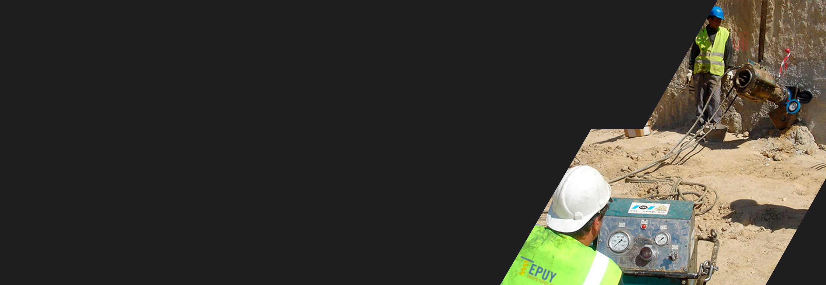 Equipo de perforación ejecutando anclajes en obra